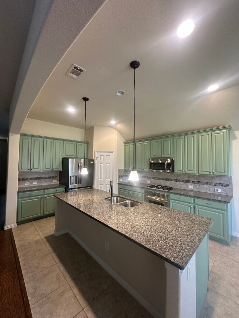 Finished sage green kitchen cabinets